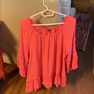 Off the shoulder pink blouse.